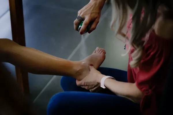 person getting sprayed on leg due to a slip and fall injury